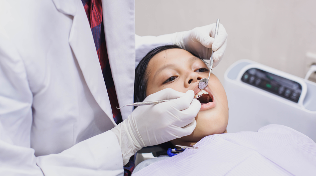 Child getting his teeth checked at Greenville Oral Surgery